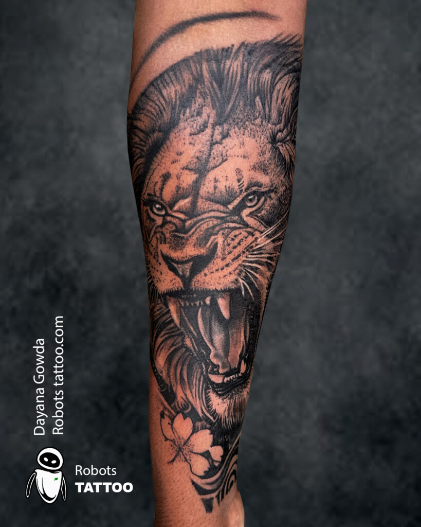 Roaring lion tattoo in black and grey realism style